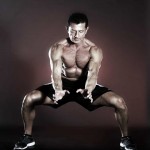 Nitro kick chi gong exercise in horse stance legs wide and low in stance
